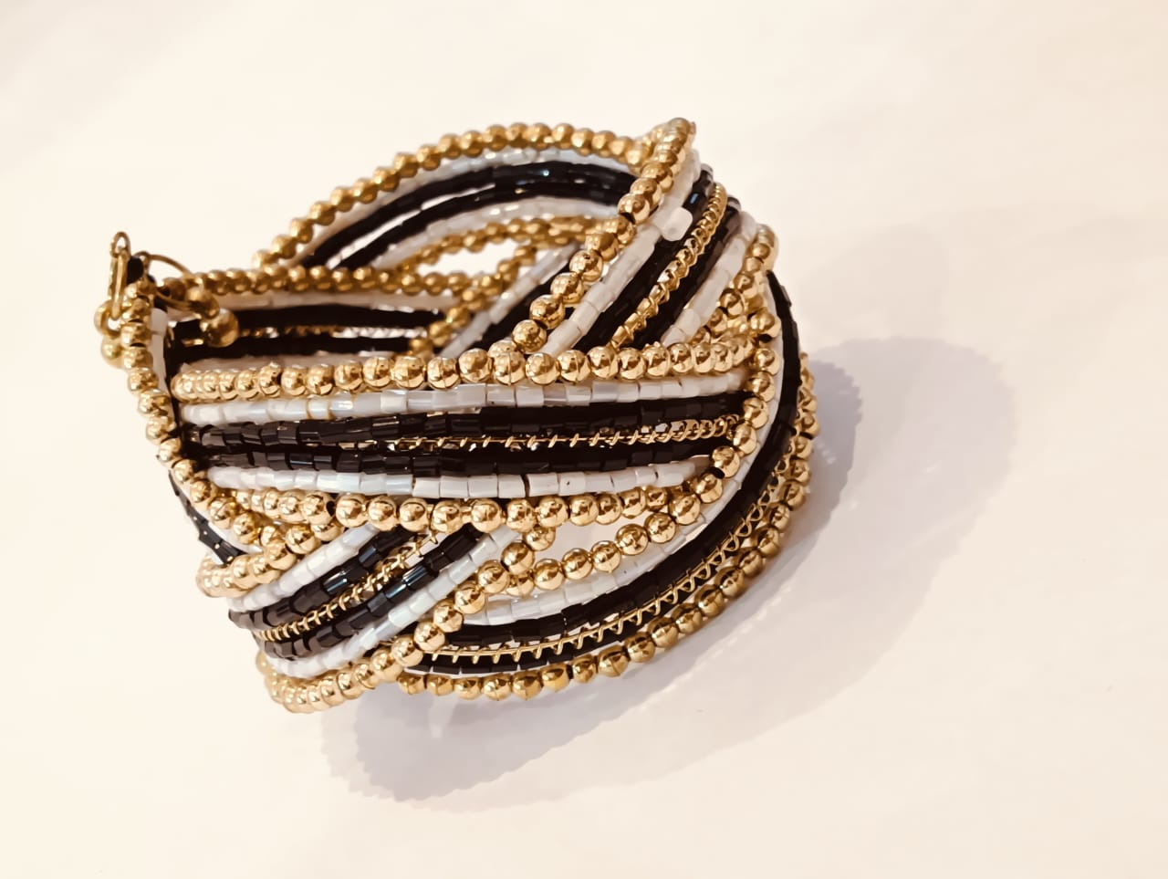 Chic Black and White Beaded Bangle with Golden Detailing